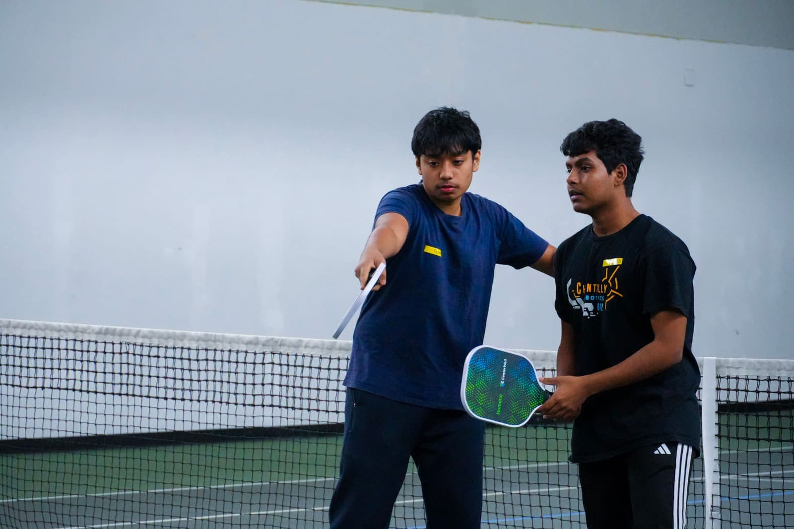 Two players at the net between points