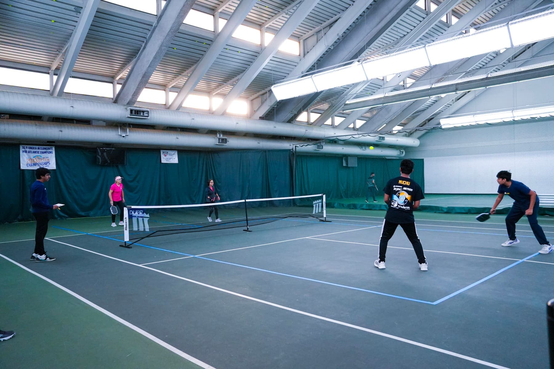 Doubles rally at the net