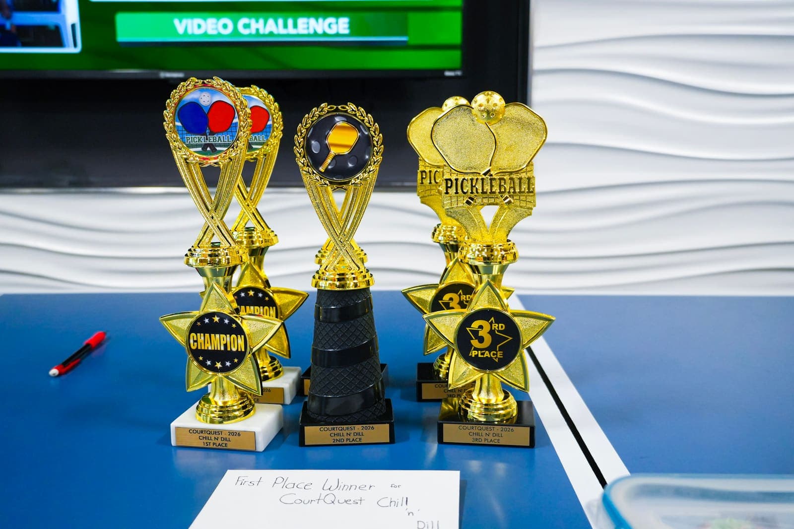 Championship trophies lined up courtside