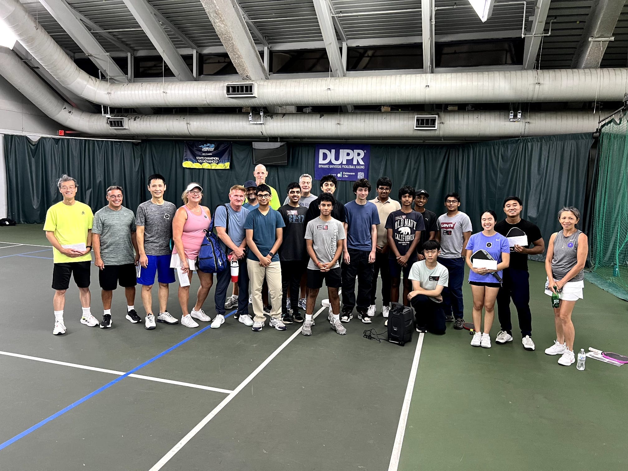 The CourtQuest community gathered on court at the Rally Royale closing ceremony